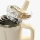 Close up of yellow bottle, showing the detail of the lid and straw