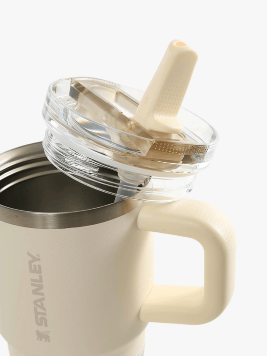 Close up of yellow bottle, showing the detail of the lid and straw