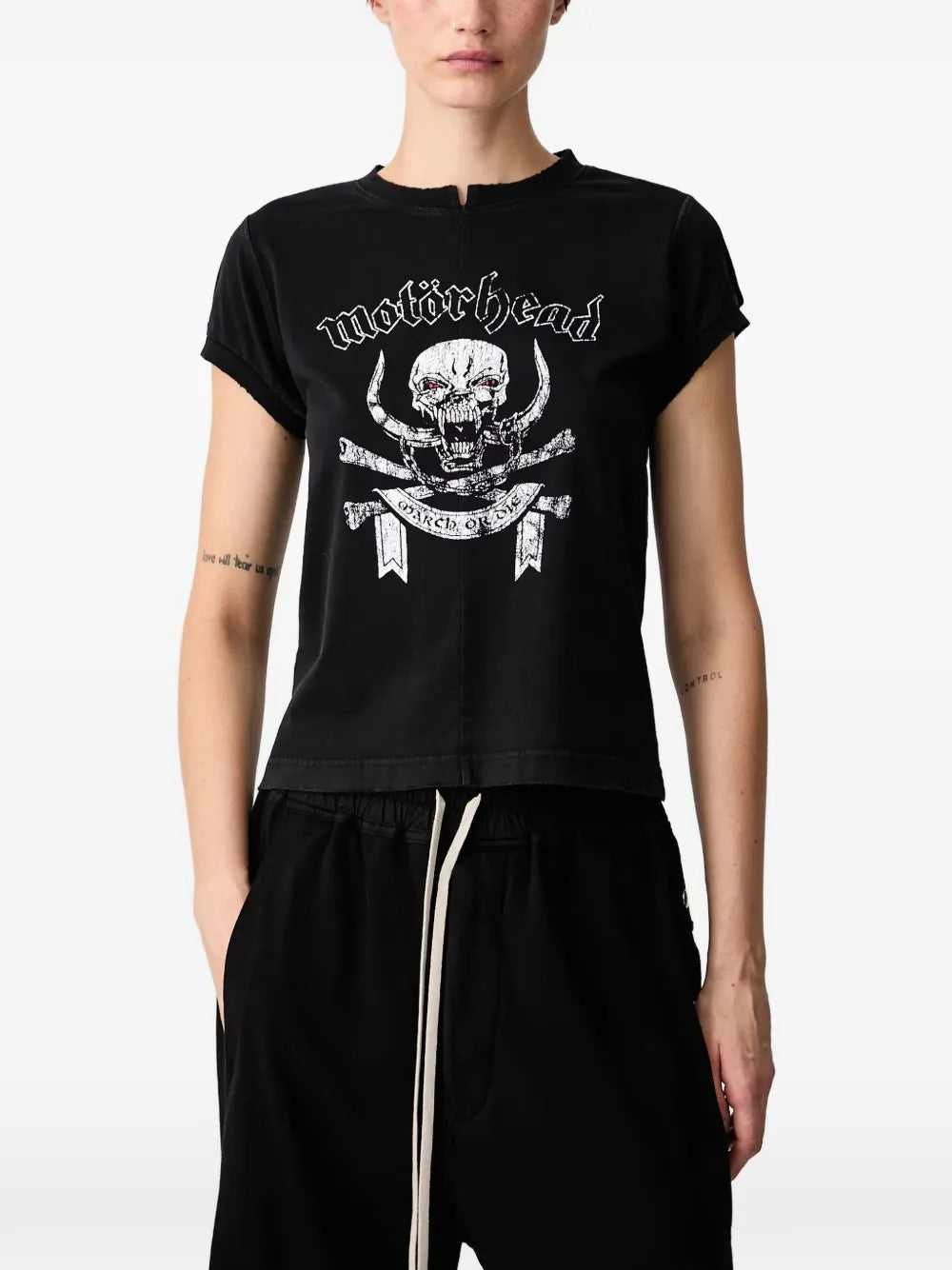 Black t-shirt worn by a person, showing the t-shirt fit