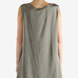 Grey tops worn by a person, showing the tops fit