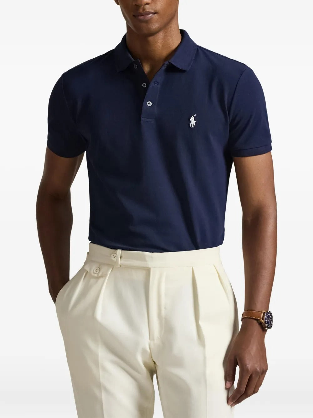 Navy shirt worn by a person, showing the shirt's fit