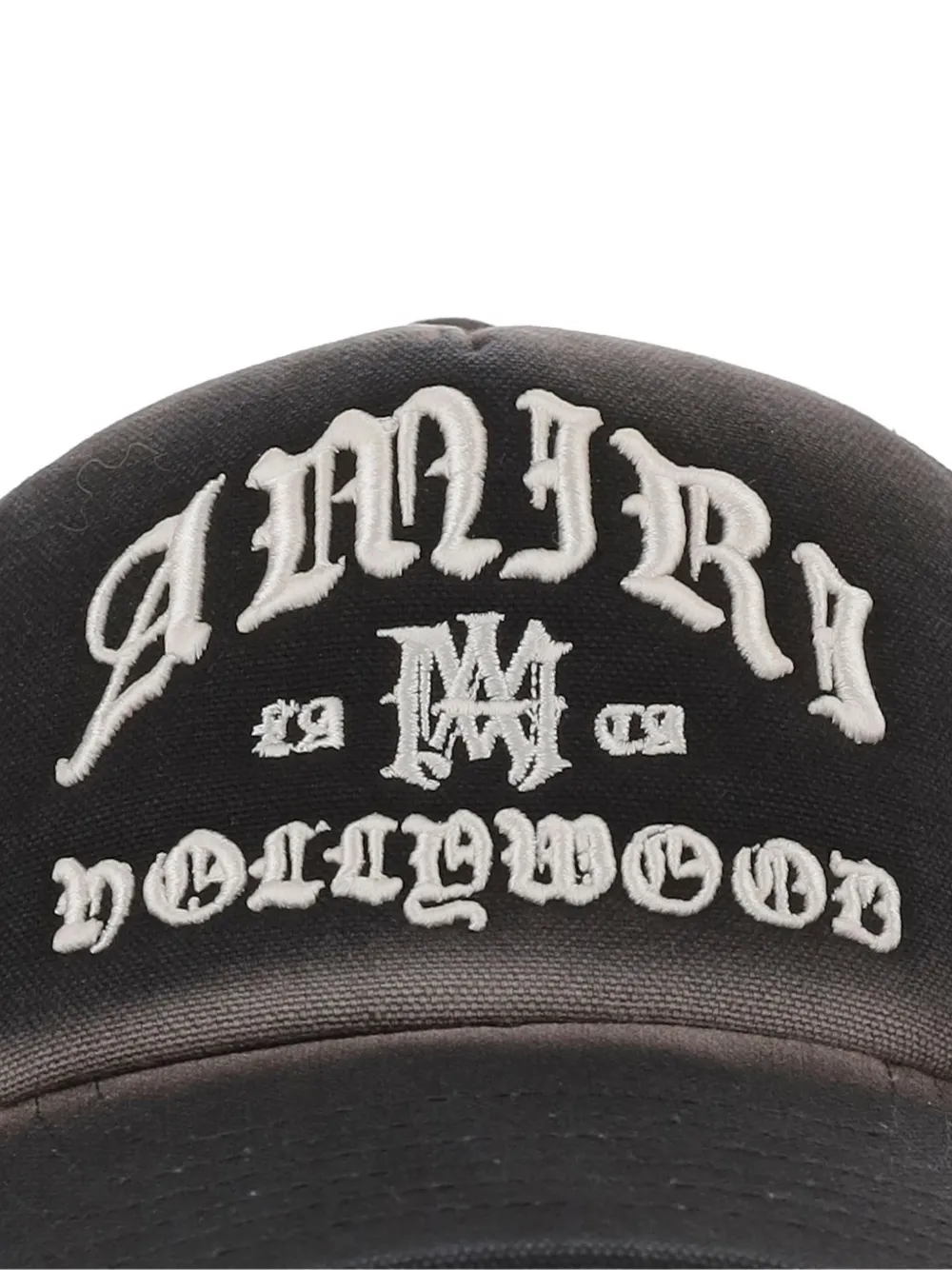 Close up of black hat, showing texture of the cotton fabric