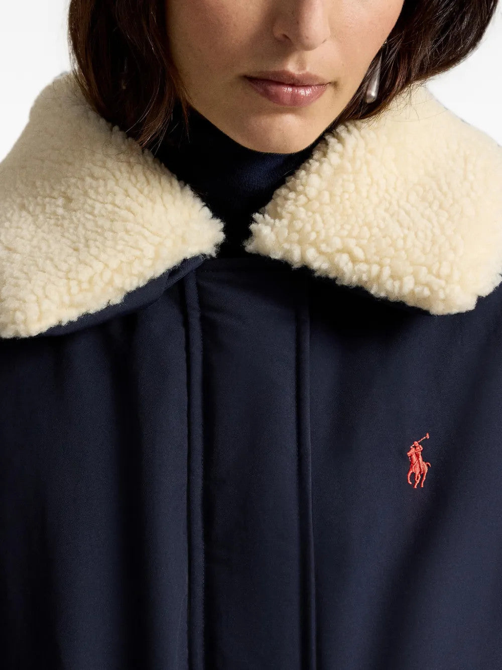 Navy jacket worn by a person, showing the jacket fit