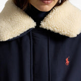 Navy jacket worn by a person, showing the jacket fit