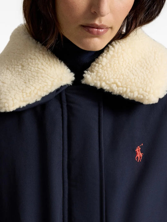 Navy jacket worn by a person, showing the jacket fit