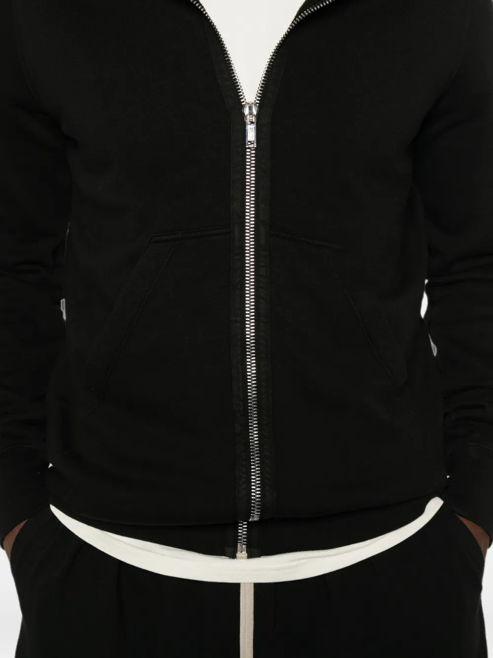 Black hoodie worn by a person, showing the hoodie fit