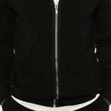 Black hoodie worn by a person, showing the hoodie fit