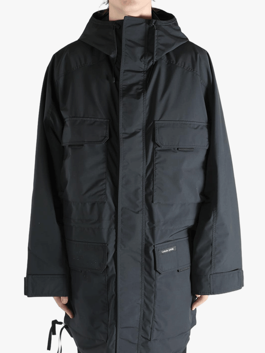 Black jacket worn by a person, showing the jacket's fit