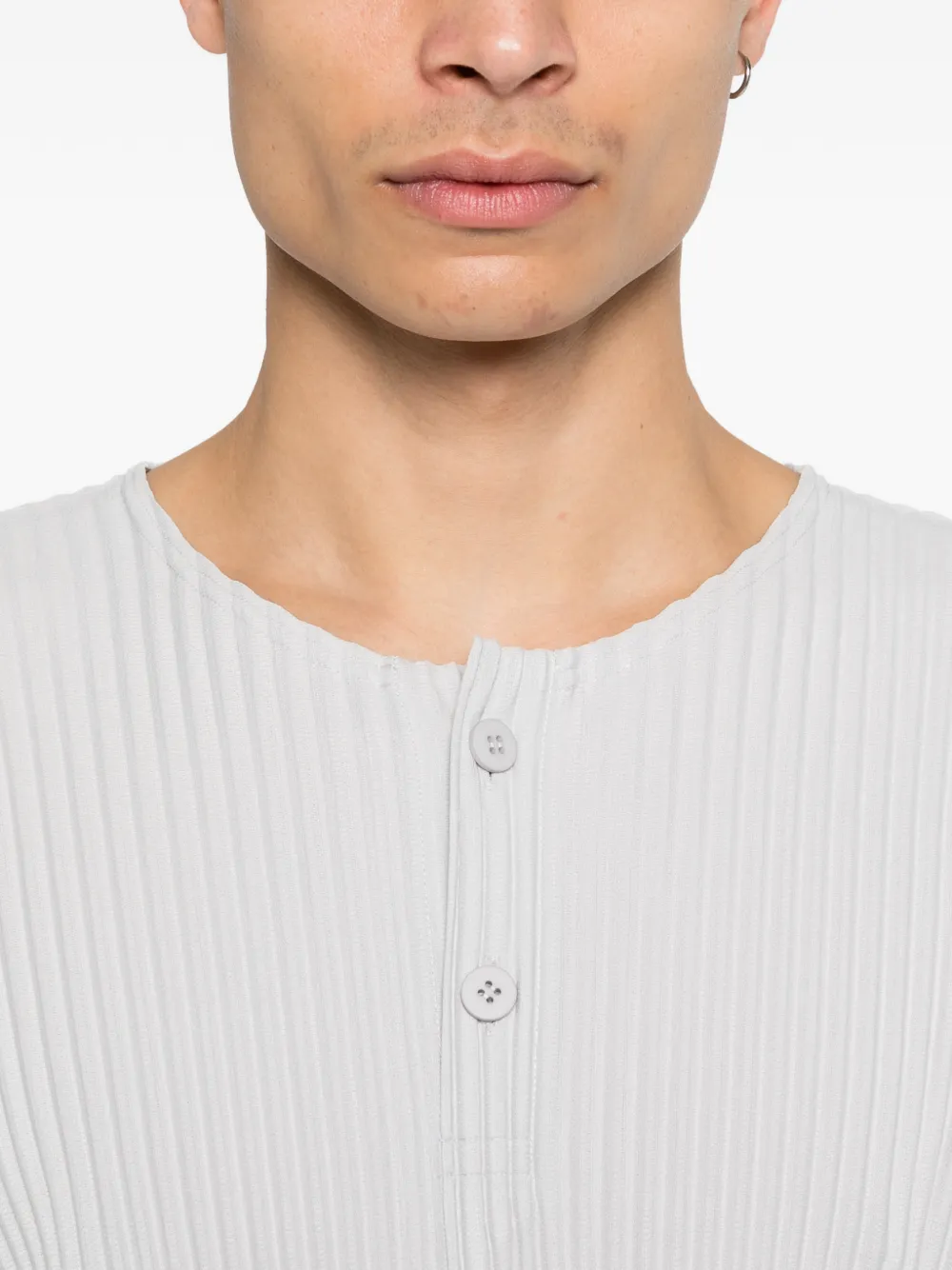 close up of white t-shirts, showing texture of the polyester fabric