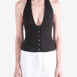 Black top worn by a person, showing the top fit