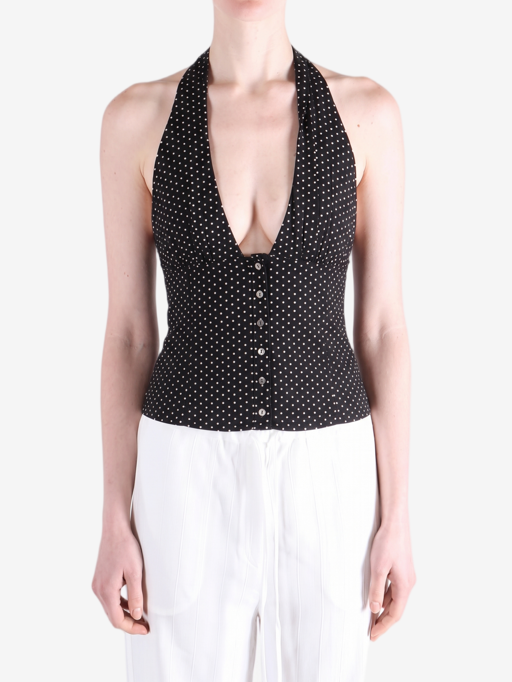 Black top worn by a person, showing the top fit