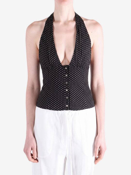 Black top worn by a person, showing the top fit