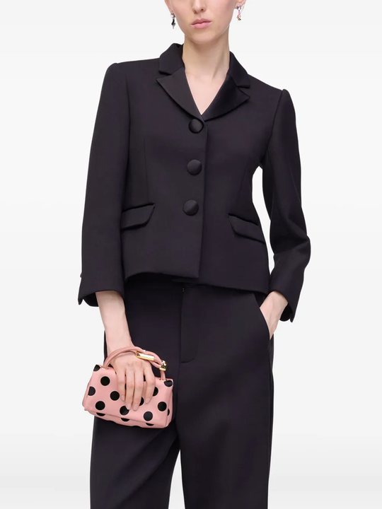 Pink bag worn by a person, showing the bags fit