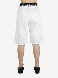 White short worn by a person, showing the short's fit