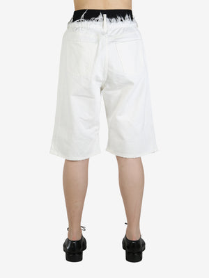 White short worn by a person, showing the short's fit