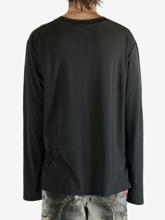 Black t-shirt worn by a person, showing the t-shirt's fit