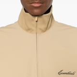 Close up of tan coats, showing texture of the blended fabric