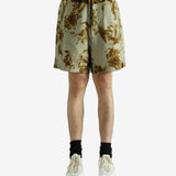 Green pants worn by a person, showing the pants' fit