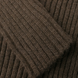 Close up of brown sweater, showing the detial of the sleeve