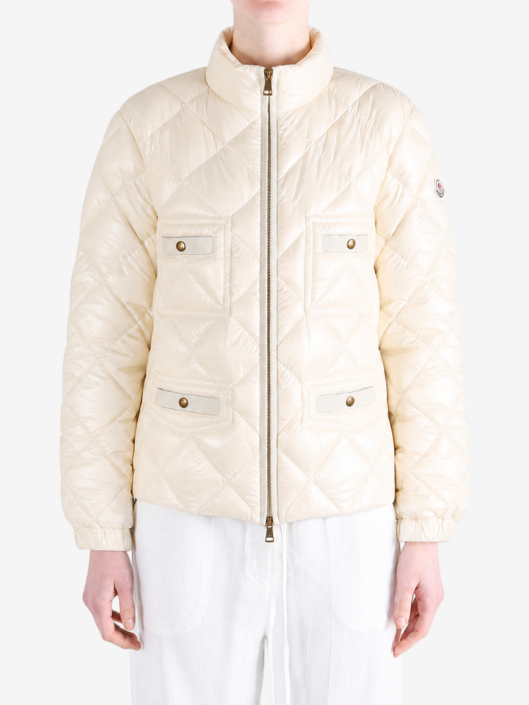 White jacket worn by a person, showing the jacket fit