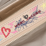 close up of white bags, showing texture of the cow leather fabric