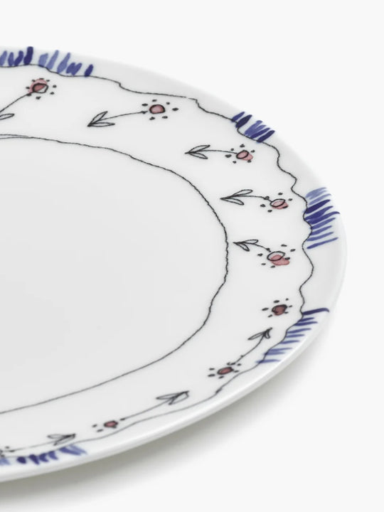 Close up of blue plate, showing texture of the bone porcelain fabric