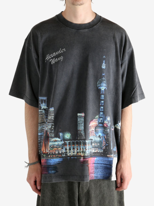 Black shirt worn by a person, showing the shirt fit