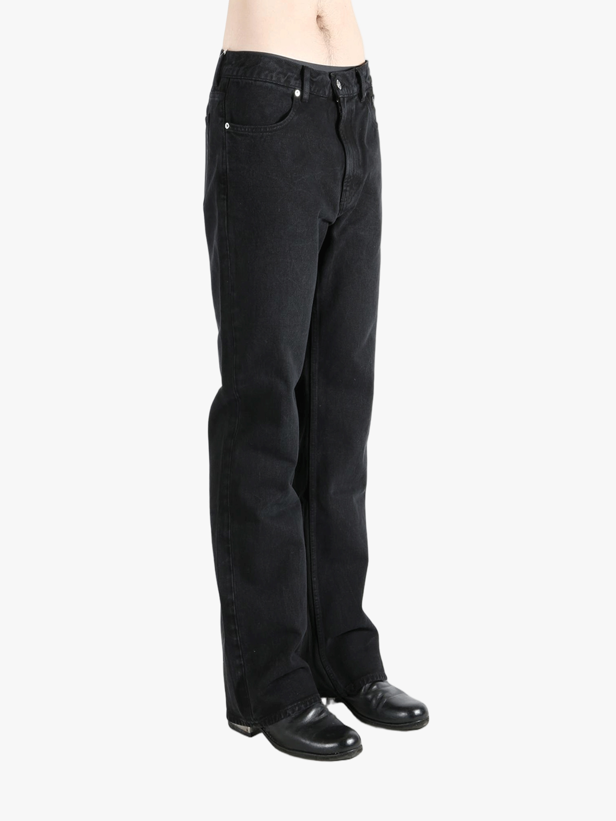 Black pant worn by a person, showing the pant's fit
