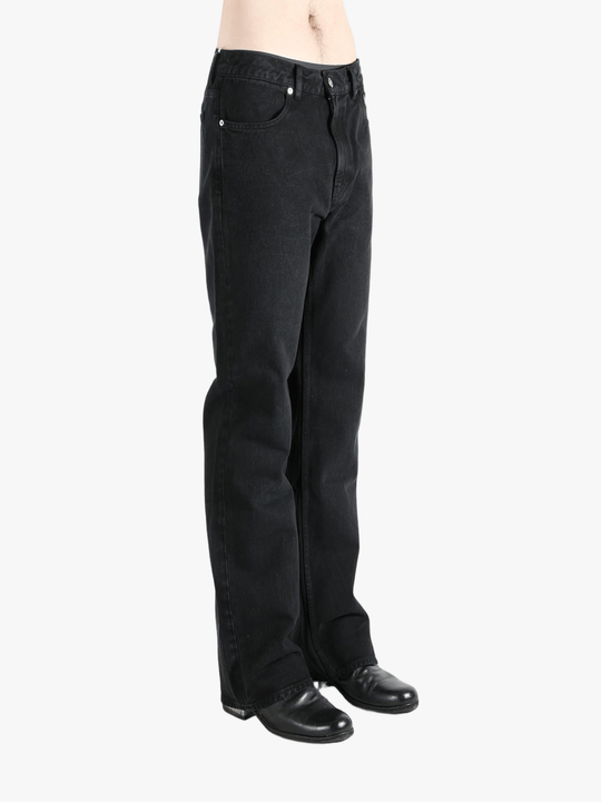 Black pant worn by a person, showing the pant's fit
