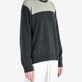Grey hoodie worn by a person, showing the hoodie fit