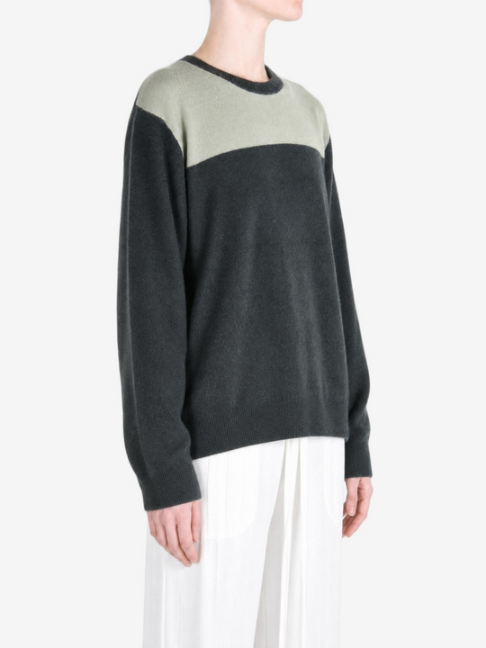 Grey hoodie worn by a person, showing the hoodie fit