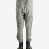 Grey pants worn by a person, showing the pants's fit