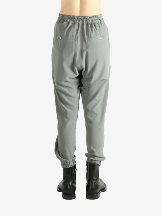 Grey pants worn by a person, showing the pants's fit