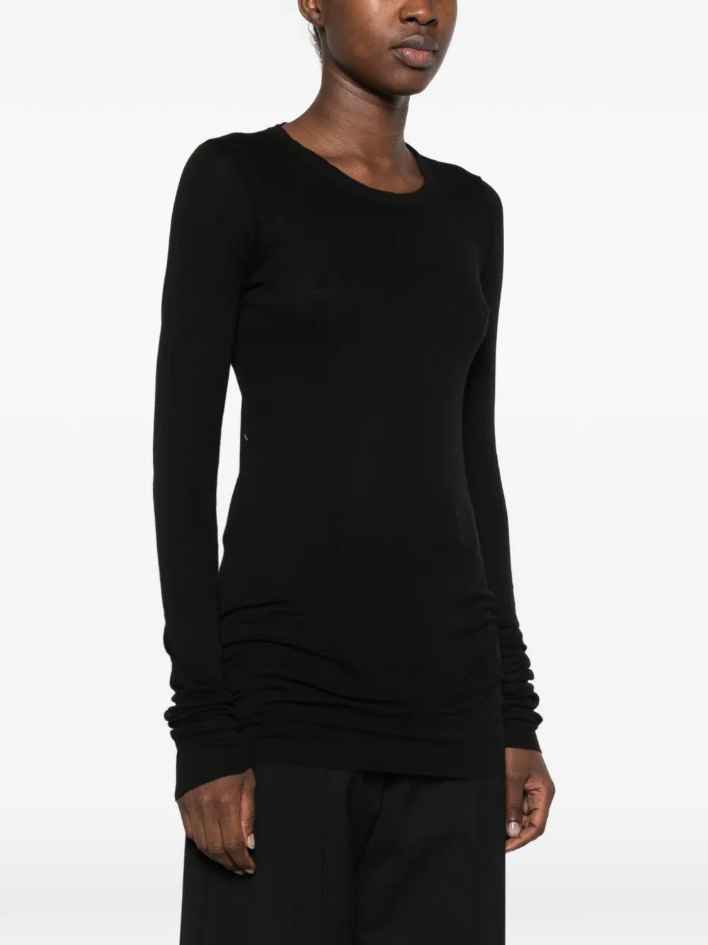 Black t-shirt worn by a person, showing the t-shirt fit