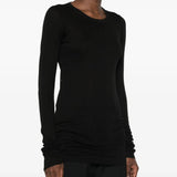 Black t-shirt worn by a person, showing the t-shirt fit