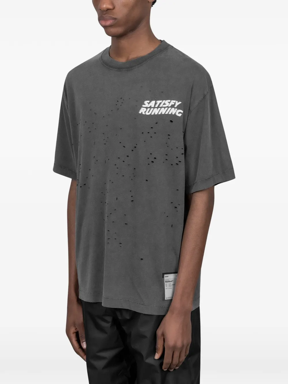 Grey t-shirt worn by a person, showing the t-shirt fit