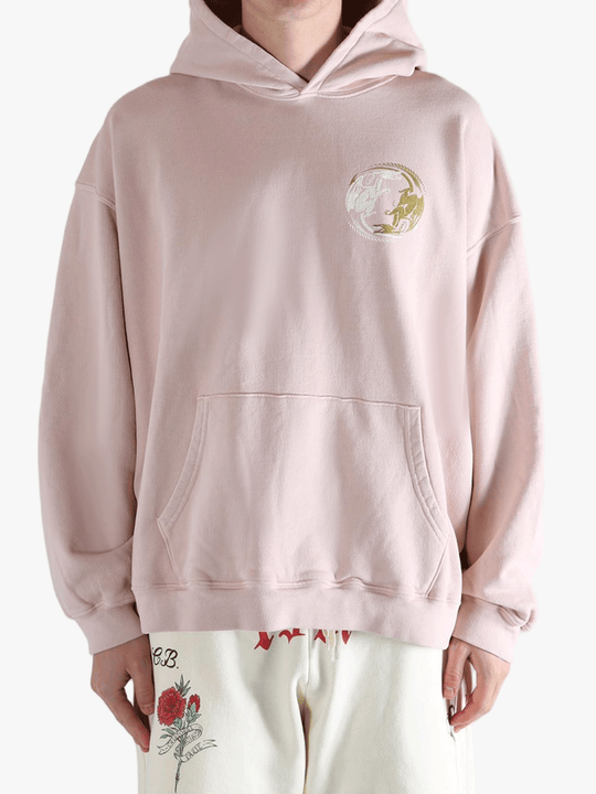 Pink hoodie worn by a person, showing the hoodie's fit