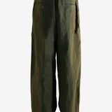 Green pants worn by a person, showing the pants' fit