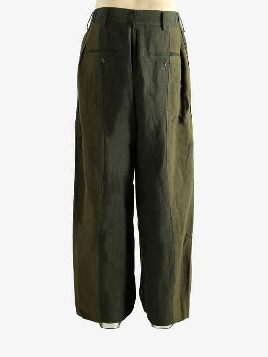 Green pants worn by a person, showing the pants' fit