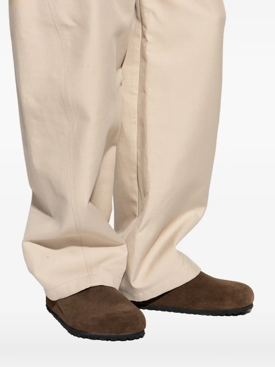 brown sandals worn by a person, showing the sandals fit