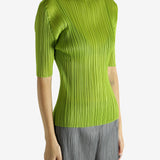 Green shirt worn by a person, showing the shirt's fit