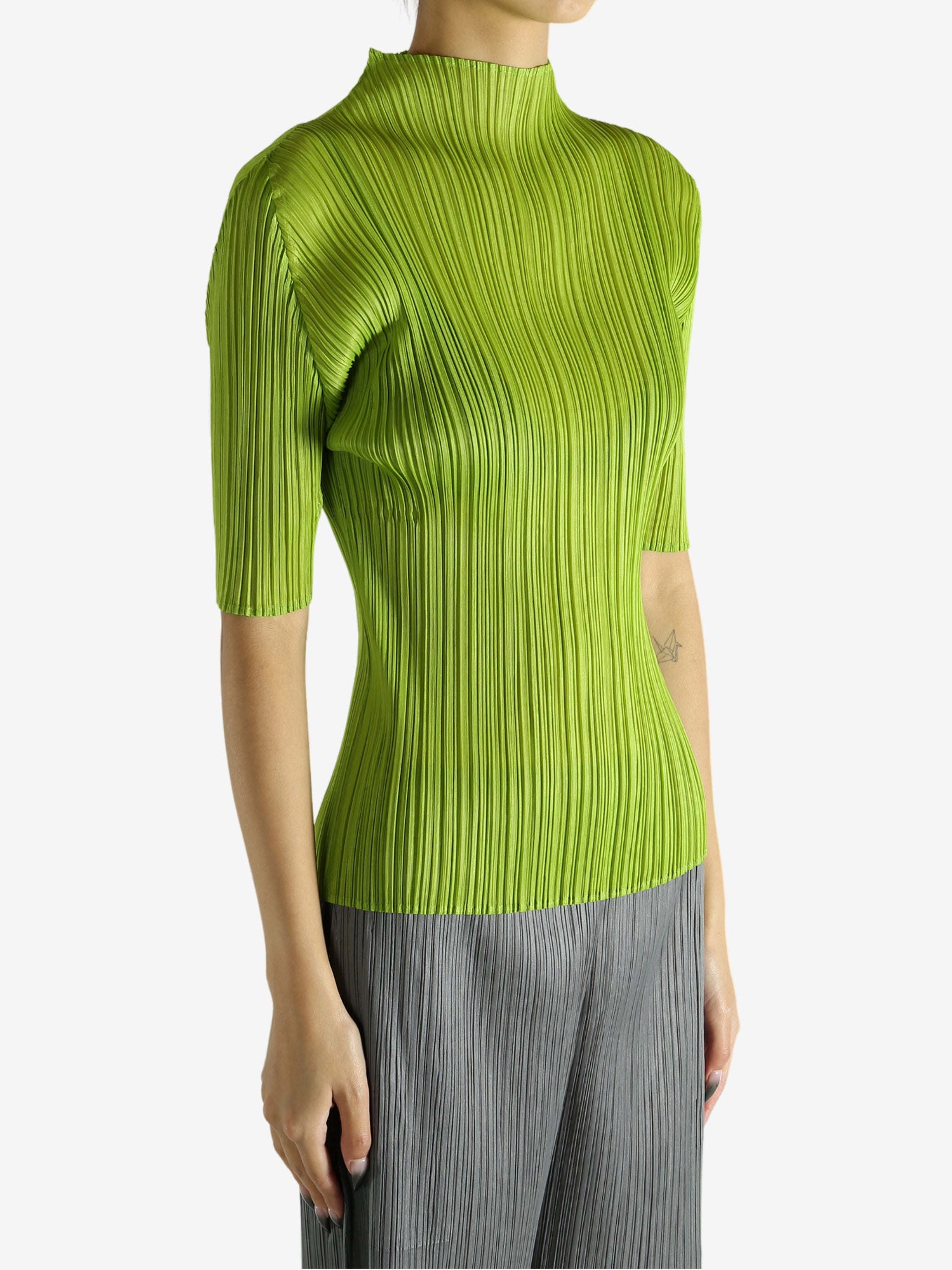 Green shirt worn by a person, showing the shirt's fit