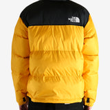 Yellow jacket worn by a person, showing the jacket's fit