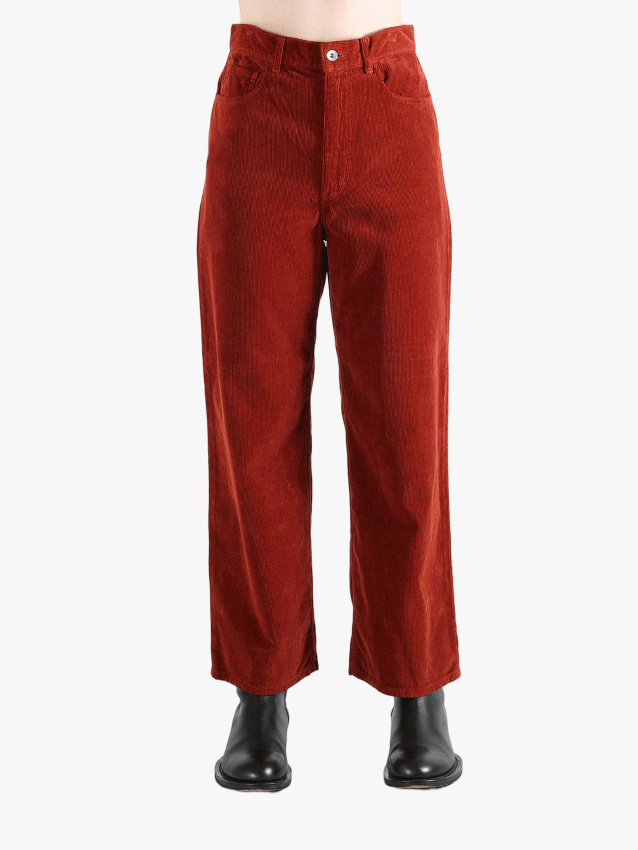 Red pants worn by a person, showing the pant's fit
