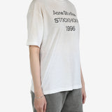 White t-shirt worn by a person, showing the t-shirt's fit