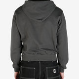 Grey hoodie worn by a person, showing the hoodie's fit