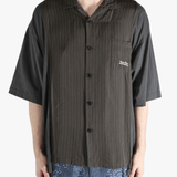 Brown shirt worn by a person, showing the shirt's fit