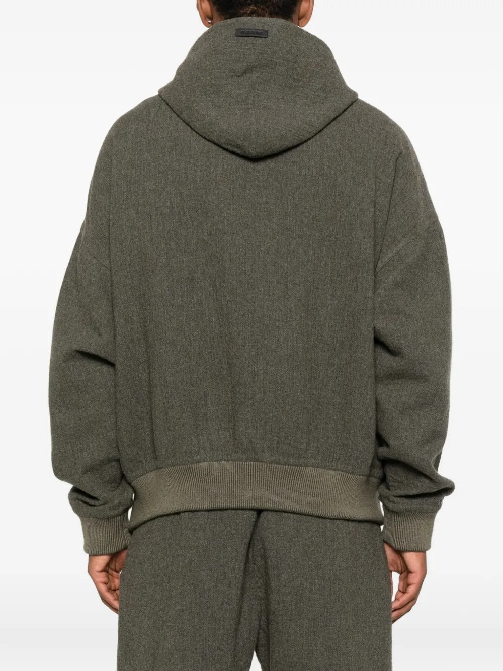 Black hoodie worn by a person, showing the hoodie's fit