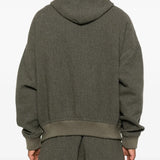 Black hoodie worn by a person, showing the hoodie's fit