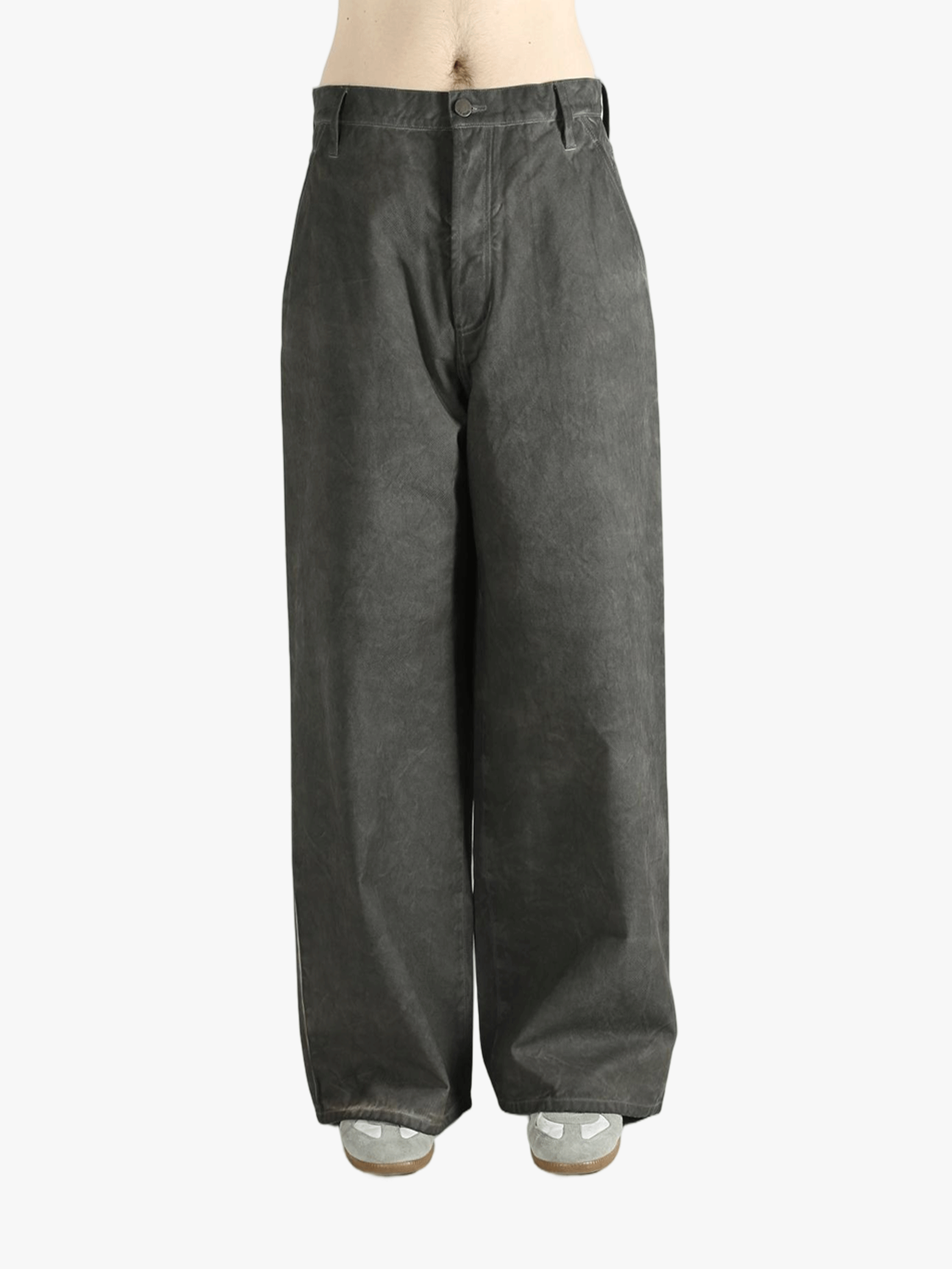 Grey pants worn by a person, showing the pants' fit